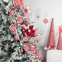 Northlight 30" Candy Cane Swirls And Pom Poms Christmas Garland -Winter Decor Store northlight df94827 styled 28794.1693409622